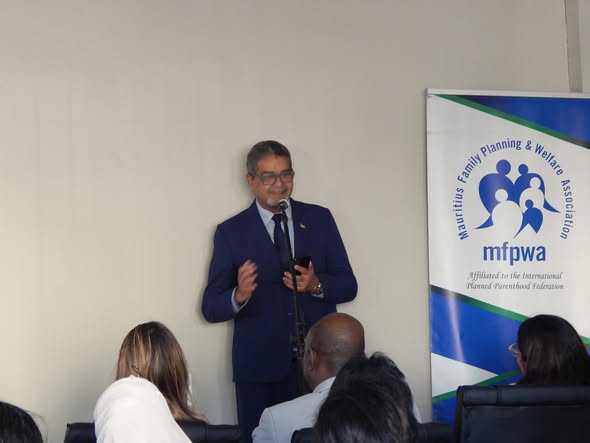 The Vice-President addresses guests beside the MFPWA banner